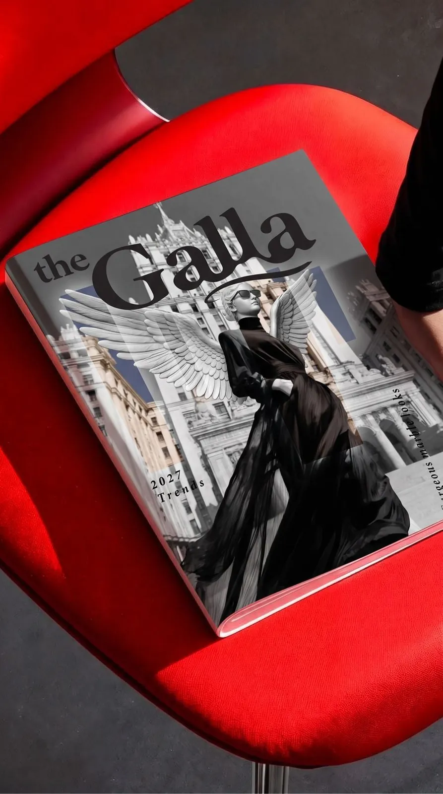 the Galla magazine on a red car seat