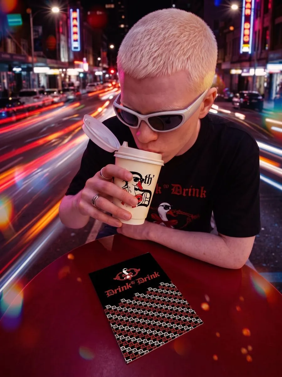 person holding two branded cups outdoors